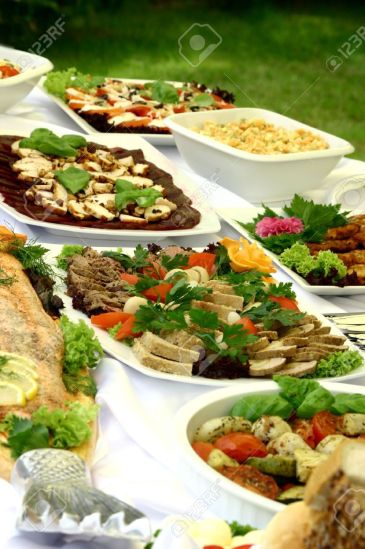 1349490-View-at-delicious-platters-standing-together-on-smorgasbord-Stock-Photo